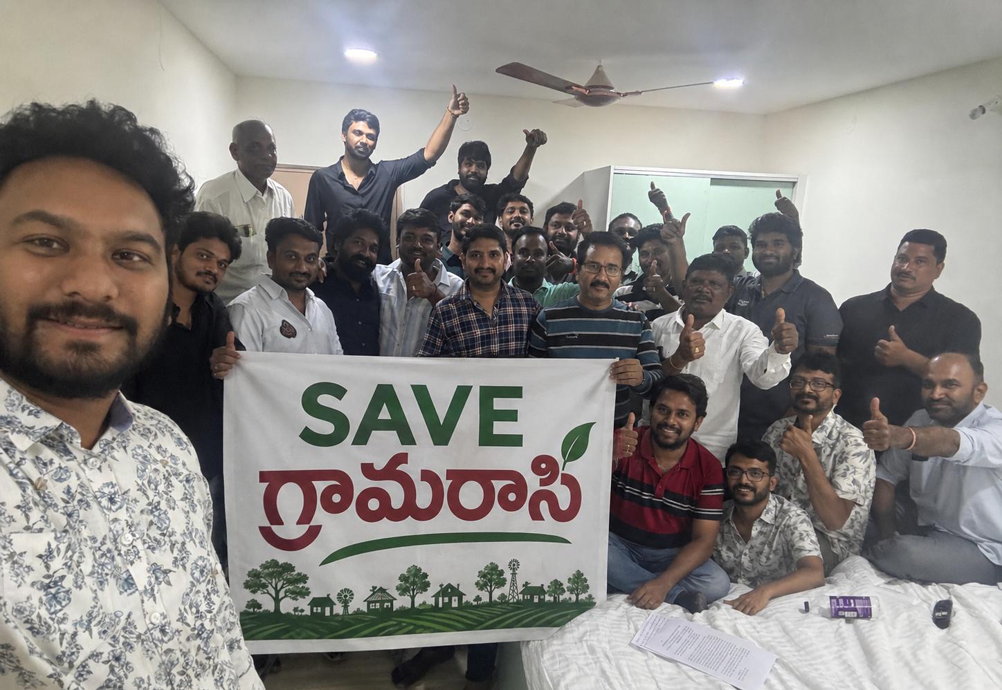 Kunchaparthi youth holding the Save Grama Raasi banner